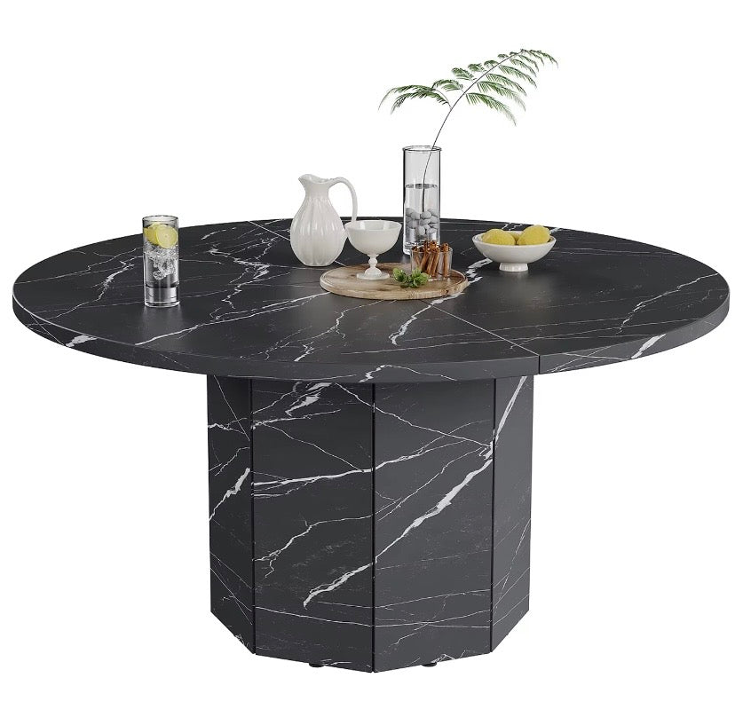 Round black marble-effect dining table with smooth tabletop and pedestal base