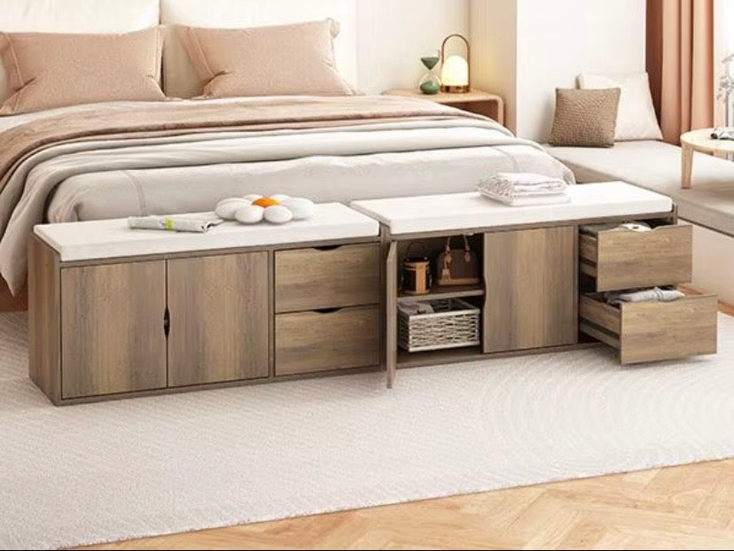 Wood storage bench ottoman with cushion top, cabinet doors, and drawers along the side